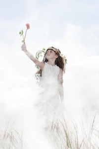 Girl dressed as fairy with flower